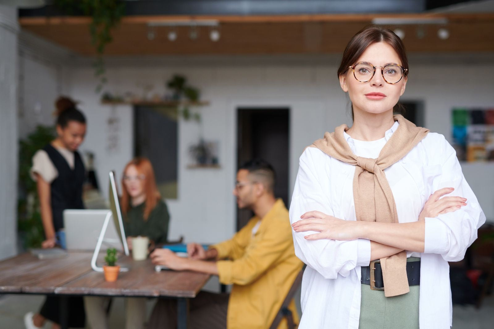 A confident young professional in a modern office, representing starting a project management career with the CAPM.