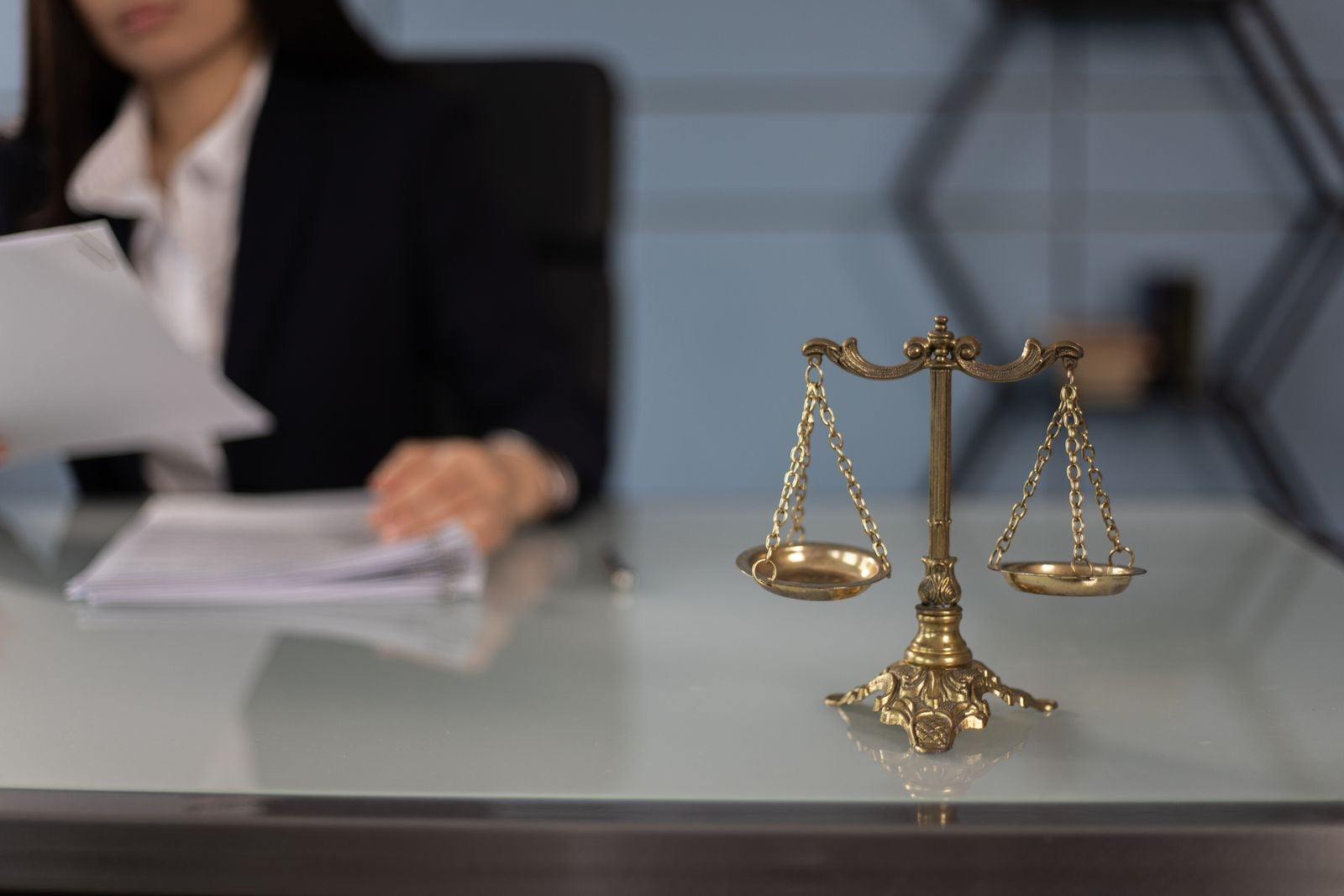 Balance scales on a desk in an office, representing the PMI Code of Ethics.